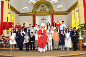 Archbishop Smith celebrated Confirmation or offered a blessing to 25 youth at St. Vital parish. 