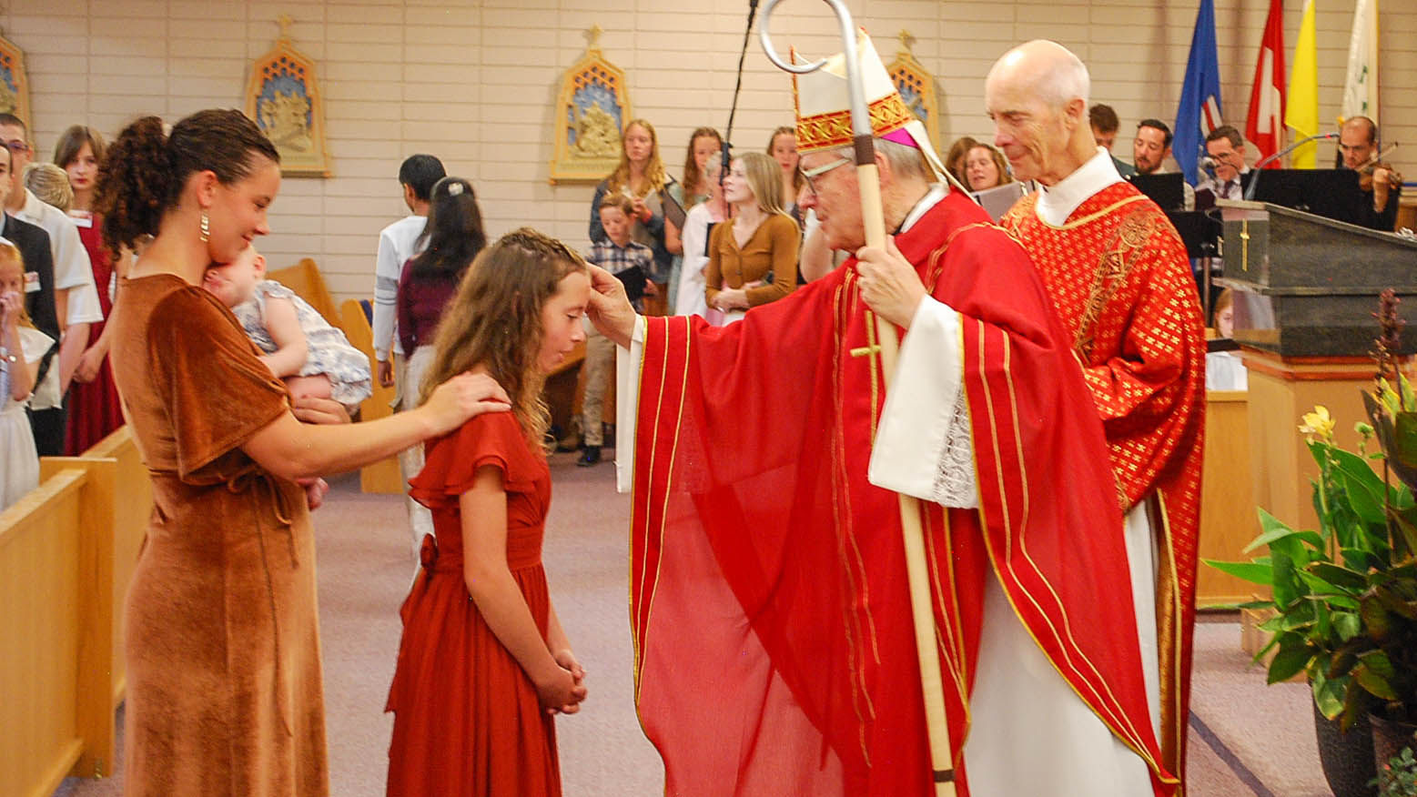 Bishjop Paul Administering The Sacrament Of Confirmation.